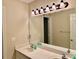 Bright bathroom features dual sinks, a large mirror, and modern lighting fixtures at 105 Abbotsford Ct, Durham, NC 27712
