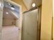 Bathroom showcasing glass shower doors and a view into another room at 105 Abbotsford Ct, Durham, NC 27712
