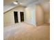 Cozy bedroom with beige carpet, with a door opening to another room at 105 Abbotsford Ct, Durham, NC 27712