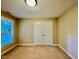 Bedroom featuring a window and a double door closet at 105 Abbotsford Ct, Durham, NC 27712