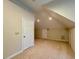 Large bedroom with vaulted ceilings and two doors, perfect for versatile use at 105 Abbotsford Ct, Durham, NC 27712