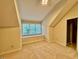Bedroom featuring a window seat and carpeted floors in a well-lit room at 105 Abbotsford Ct, Durham, NC 27712