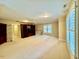 Large bonus room with a ceiling fan, carpet and built in bookcases at 105 Abbotsford Ct, Durham, NC 27712