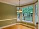 Cozy breakfast nook with large windows, perfect for enjoying your morning coffee at 105 Abbotsford Ct, Durham, NC 27712