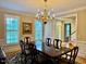 Spacious dining area with natural light and dark wood table, great for entertaining at 105 Abbotsford Ct, Durham, NC 27712