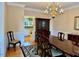 Formal dining area featuring a wooden table, china cabinet, and decorative chandelier at 105 Abbotsford Ct, Durham, NC 27712