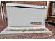 An outdoor generator beside a brick home, providing reliable power and peace of mind at 105 Abbotsford Ct, Durham, NC 27712