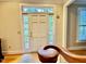 Inviting home front door featuring window panes allowing natural light, and classic white door at 105 Abbotsford Ct, Durham, NC 27712