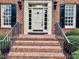 Inviting front entrance with brick steps and classic architectural details at 105 Abbotsford Ct, Durham, NC 27712