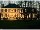 Festive brick home adorned with wreaths, creating a warm and welcoming atmosphere at 105 Abbotsford Ct, Durham, NC 27712