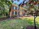 Elegant brick home featuring well-maintained landscaping and a charming front yard at 105 Abbotsford Ct, Durham, NC 27712