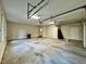 Spacious garage featuring automatic doors and concrete flooring at 105 Abbotsford Ct, Durham, NC 27712