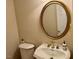 Powder room with a gilded mirror and vintage-style sink at 105 Abbotsford Ct, Durham, NC 27712