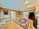 Well lit living room showcasing hardwood floors, fireplace, and area rug at 105 Abbotsford Ct, Durham, NC 27712