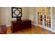 Home office featuring dark-wood desk, hardwood floors and glass doors at 105 Abbotsford Ct, Durham, NC 27712