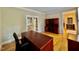 Home office featuring hardwood floors and built-in storage at 105 Abbotsford Ct, Durham, NC 27712