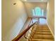 View from staircase featuring a large arched window, adding architectural charm at 105 Abbotsford Ct, Durham, NC 27712