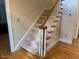 Classic staircase featuring carpeted steps and a wooden handrail at 105 Abbotsford Ct, Durham, NC 27712