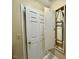 This space has a built-in ironing board, white door, and tile floor at 105 Abbotsford Ct, Durham, NC 27712