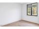 This bedroom features hardwood floors, white walls and a window providing lots of natural light at 1103 S Bloodworth St, Raleigh, NC 27601