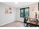 This bedroom features hardwood floors, a window providing natural light, and a desk at 1103 S Bloodworth St, Raleigh, NC 27601