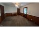 Bedroom featuring wood trim, closet, and natural light at 1116 Friendly Rd, Dunn, NC 28334