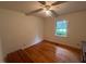 Bedroom with hardwood floors and natural light from the window at 1116 Friendly Rd, Dunn, NC 28334