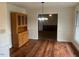 Dining room showcases hardwood floors, vintage hutch, and a view into the living space at 1116 Friendly Rd, Dunn, NC 28334