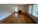 Bright living room boasting hardwood floors and large windows filling the space with natural light at 1116 Friendly Rd, Dunn, NC 28334