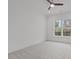 A bright, minimalist bedroom features a large window and neutral tones at 116 Pointe Park Cir, Holly Springs, NC 27540