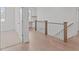 Hallway with hardwood floors and a built-in desk at 116 Pointe Park Cir, Holly Springs, NC 27540