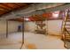 Unfinished basement featuring exposed ceiling and stairs leading to the upper level at 1186 Dick Holeman Rd, Timberlake, NC 27583