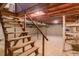 Unfinished basement featuring exposed ceiling and stairs leading to the upper level at 1186 Dick Holeman Rd, Timberlake, NC 27583