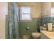 Classic bathroom features vintage tiles and a shower with a patterned curtain at 1186 Dick Holeman Rd, Timberlake, NC 27583