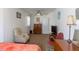 Bright bedroom featuring patterned rug, with comfortable armchair at 1186 Dick Holeman Rd, Timberlake, NC 27583