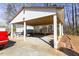 Carport of home with gravel and a view of the detached utility shed in the backyard at 1186 Dick Holeman Rd, Timberlake, NC 27583