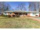 Charming single-story home with a brick facade, covered front porch, and a well-maintained front yard at 1186 Dick Holeman Rd, Timberlake, NC 27583