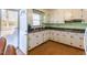 Functional kitchen with white cabinets and a cozy breakfast nook off the deck at 1186 Dick Holeman Rd, Timberlake, NC 27583