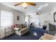 Cozy living room with a comfortable sofa, desk and lots of natural light from the windows at 1186 Dick Holeman Rd, Timberlake, NC 27583