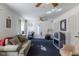 Cozy living room with a comfortable sofa, desk and lots of natural light from the windows at 1186 Dick Holeman Rd, Timberlake, NC 27583