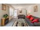 Bright living room features striped couches, plush carpeting, and a fireplace at 1186 Dick Holeman Rd, Timberlake, NC 27583