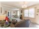 An inviting living room features sofas, plush carpeting and large windows at 1186 Dick Holeman Rd, Timberlake, NC 27583