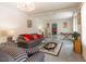 The cozy living room featuring plush sofas, a glass coffee table and natural light at 1186 Dick Holeman Rd, Timberlake, NC 27583