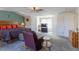 A cozy main bedroom with a relaxing seating area, soft carpet, and ample closet space at 1186 Dick Holeman Rd, Timberlake, NC 27583