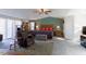 Spacious main bedroom features a seating area, soft carpet and natural light at 1186 Dick Holeman Rd, Timberlake, NC 27583