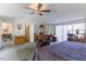 Large main bedroom with multiple closets, ceiling fan, and comfortable seating at 1186 Dick Holeman Rd, Timberlake, NC 27583