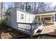 Outdoor shed with a deck, providing additional storage and outdoor space at 1186 Dick Holeman Rd, Timberlake, NC 27583