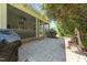 Charming backyard featuring a brick patio, water fountain, and manicured landscaping at 120 Silver Bluff St, Holly Springs, NC 27540