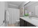 Bathroom features a single vanity with a marble countertop and a shower curtain at 120 Silver Bluff St, Holly Springs, NC 27540
