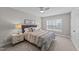 Bedroom features a ceiling fan, large window, and stylish decor at 120 Silver Bluff St, Holly Springs, NC 27540
